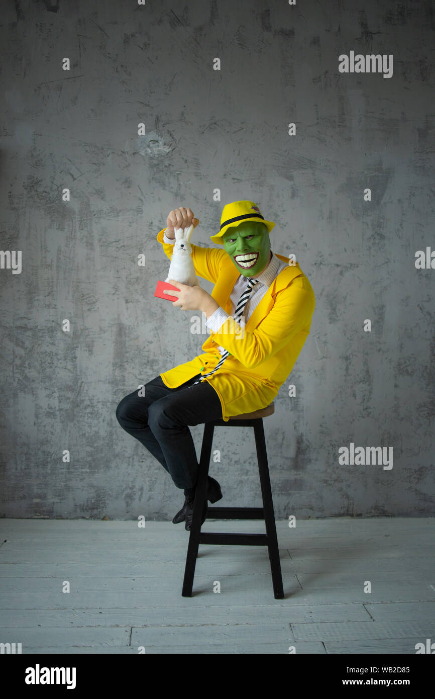 Download Jim Carey Mask Yellow Suit Green Mask As In The Movie Shooting A Film In The Hands Of An Artificial Hare Stock Photo Alamy Yellowimages Mockups