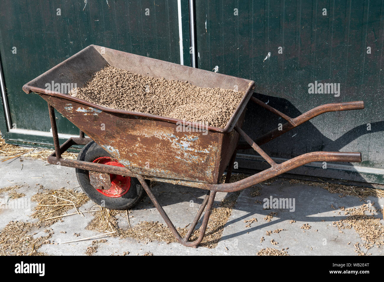 Transporting transport wheelbarrow hi-res stock photography and images ...