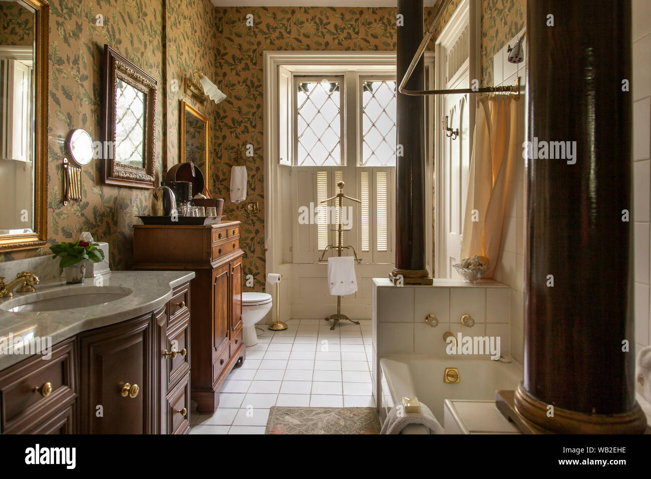 Antique luxury bathroom with brass fittings , Inn at Woodhaven, Louisville, Kentucky, USA Stock Photo