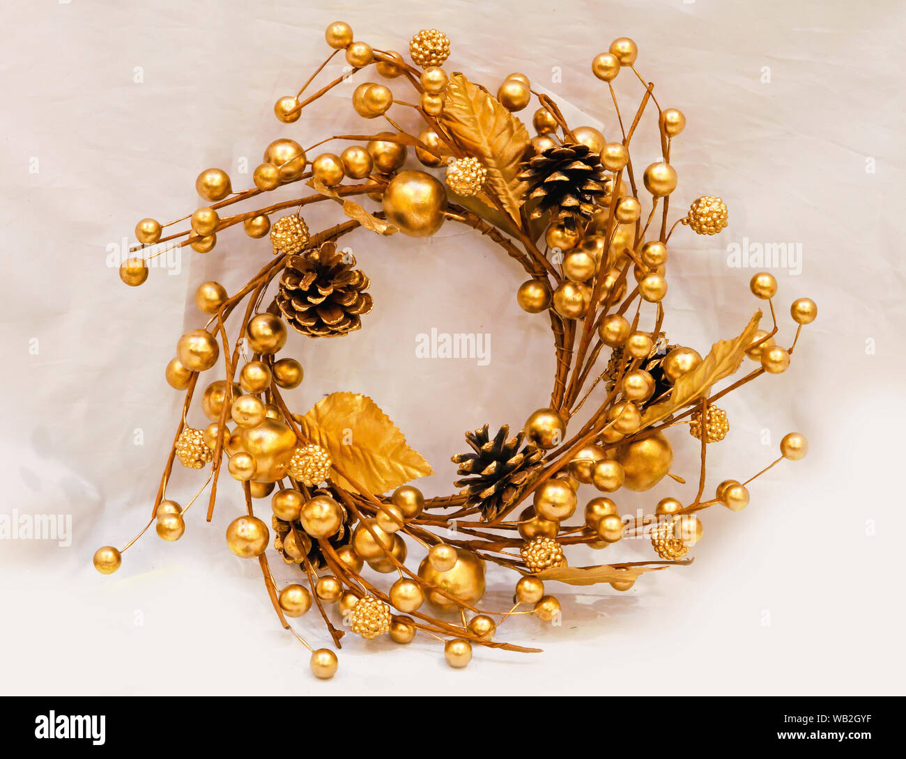 Gold Christmas Wreath With Golden Berries and Cones Stock Photo - Alamy