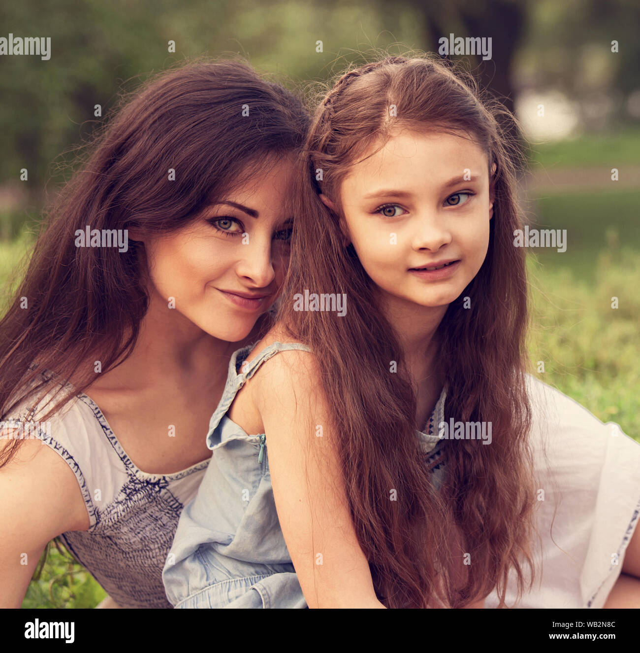 Beautiful Young Natural Mother Embracing Her Cute Long Hair