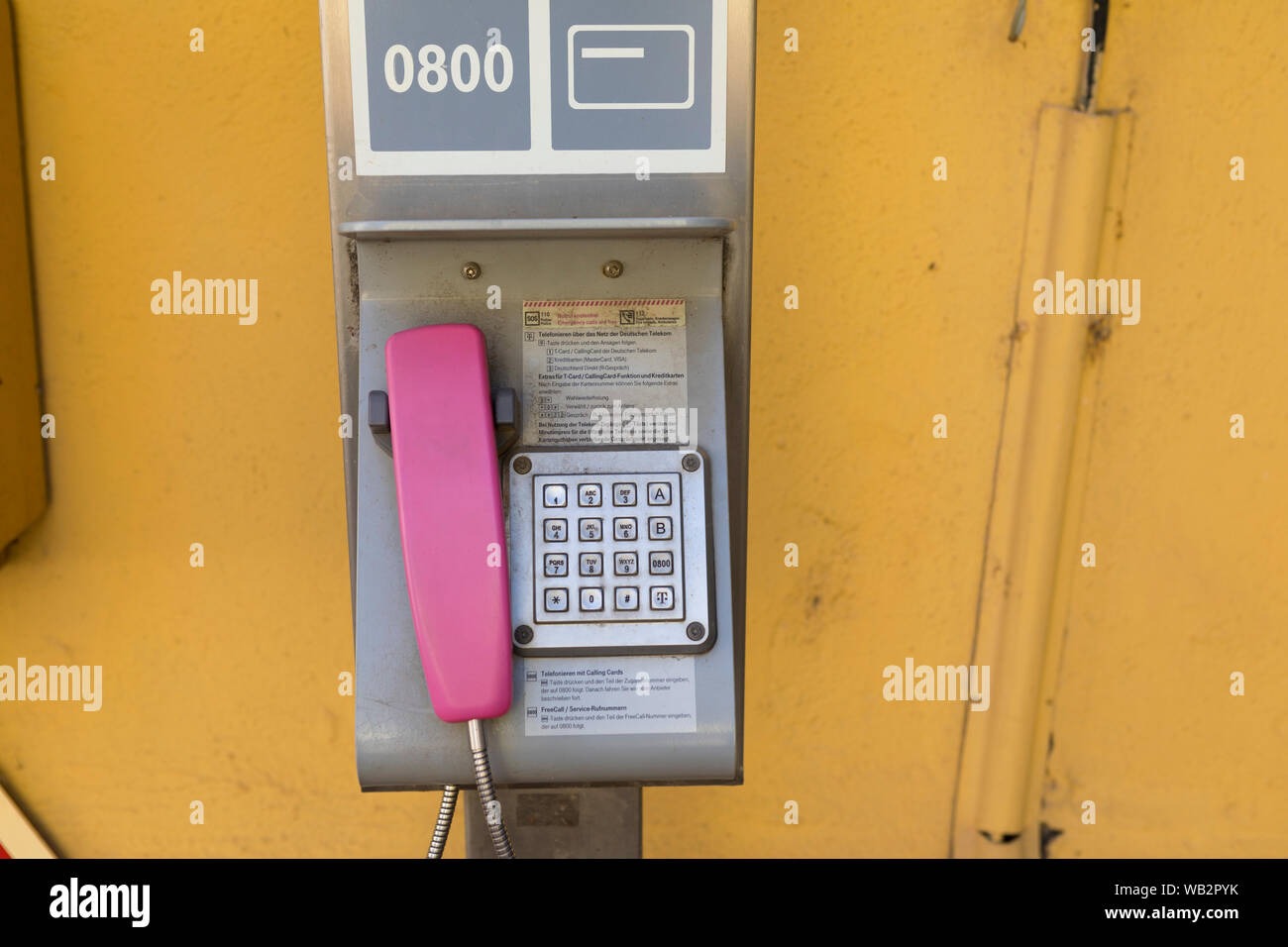 Old fashioned public telephone at the inner city post office, Nierstein Germany Stock Photo