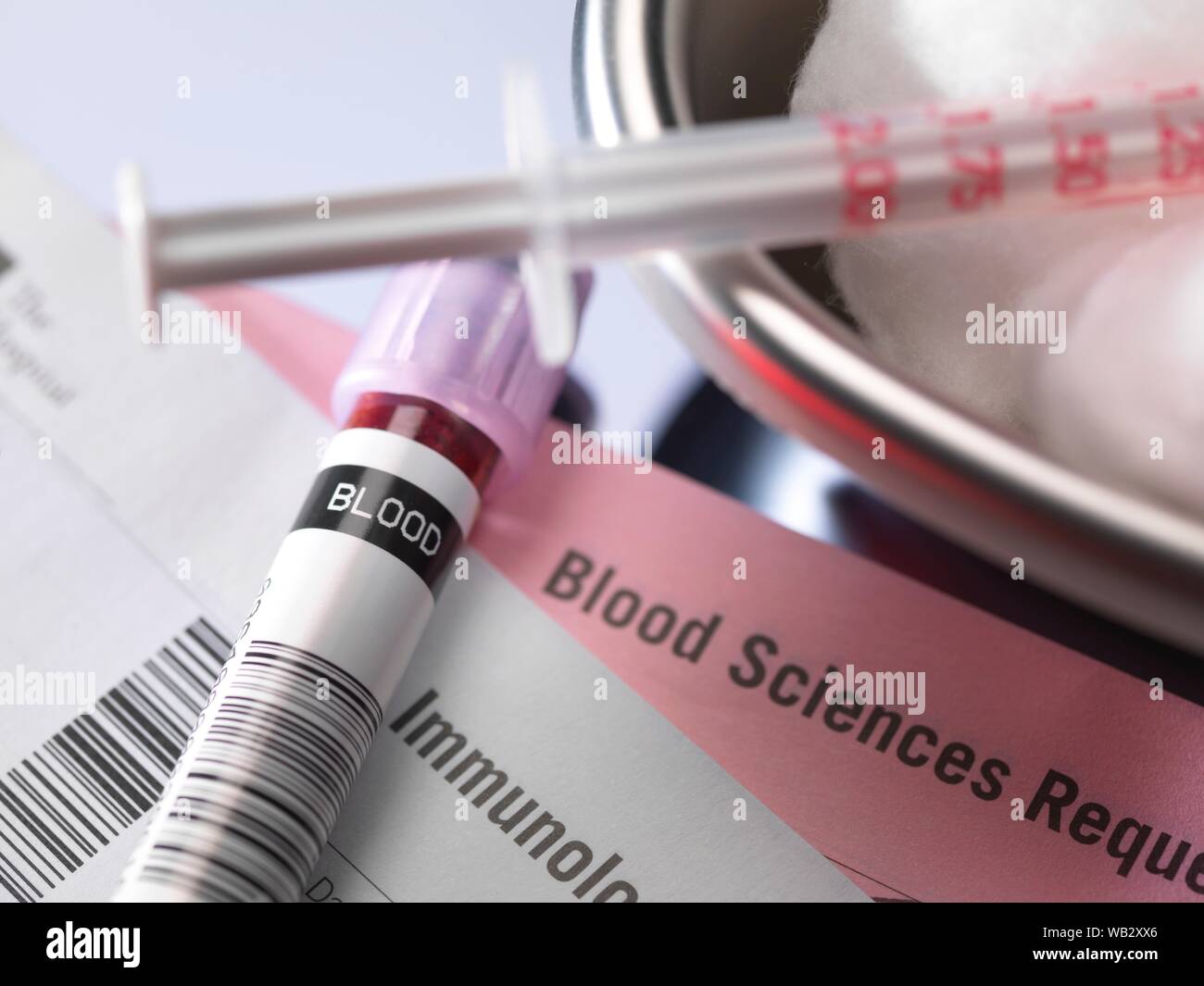 Human blood sample alongside blood test request form Stock Photo Alamy