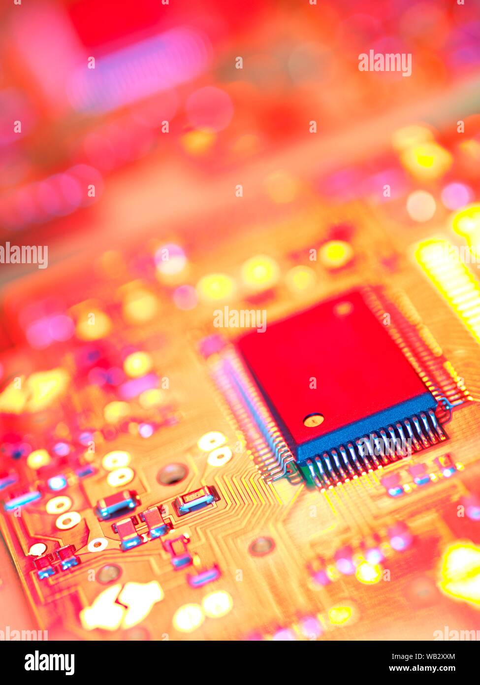 Electronic circuit board containing chips and components. Stock Photo