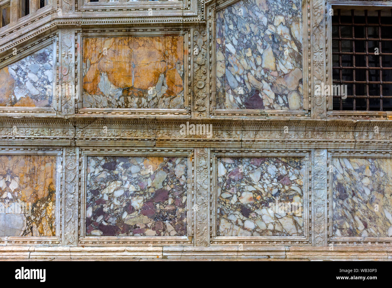 Stone panelling on the side of the Giant's Staircase (Scala dei Giganti), in the courtyard of the Doge's Palace (Palazzo Ducale), Venice, Italy Stock Photo
