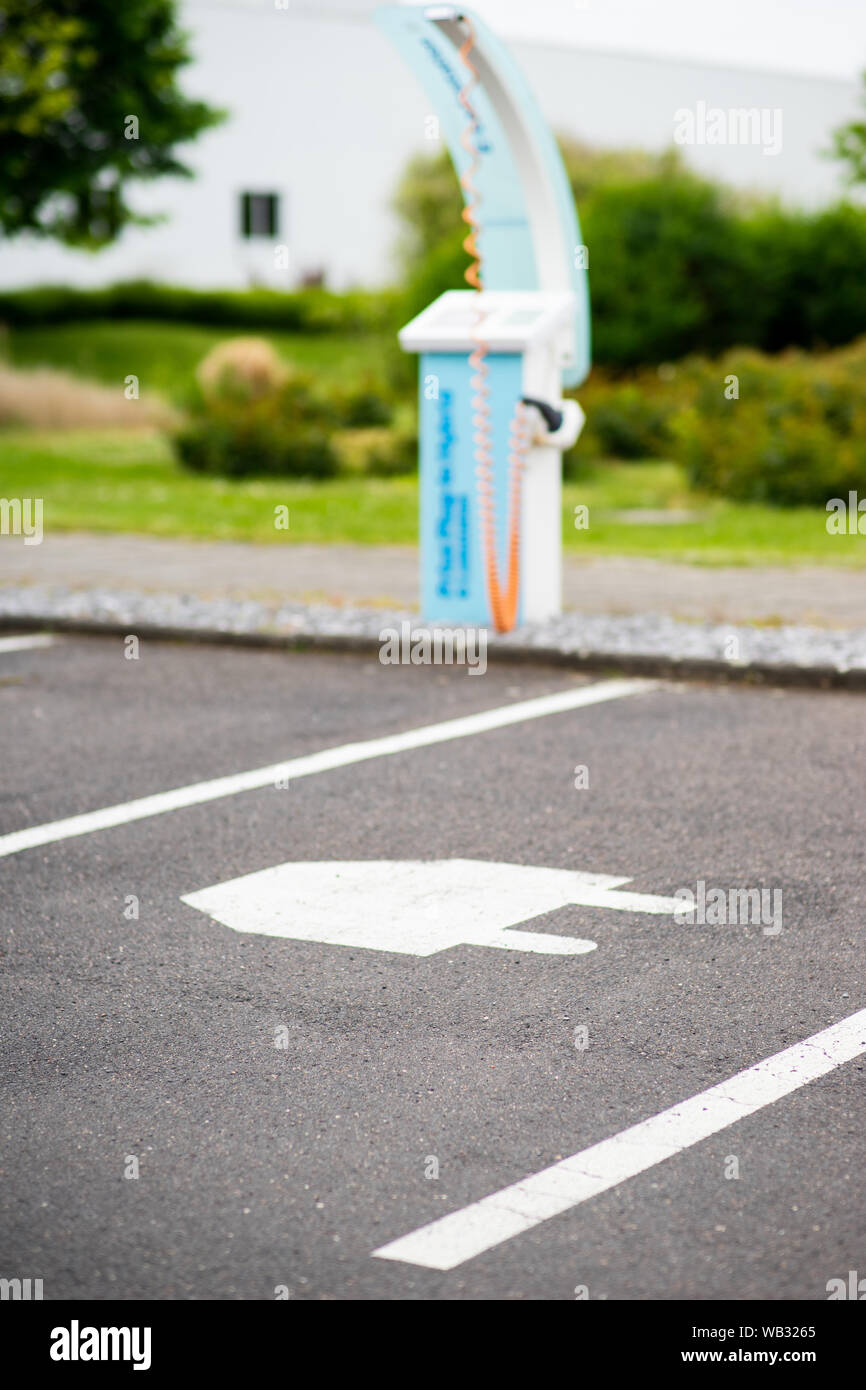 Parking symbol for electric cars, indicating charging stations in Cologne, Germany. Stock Photo