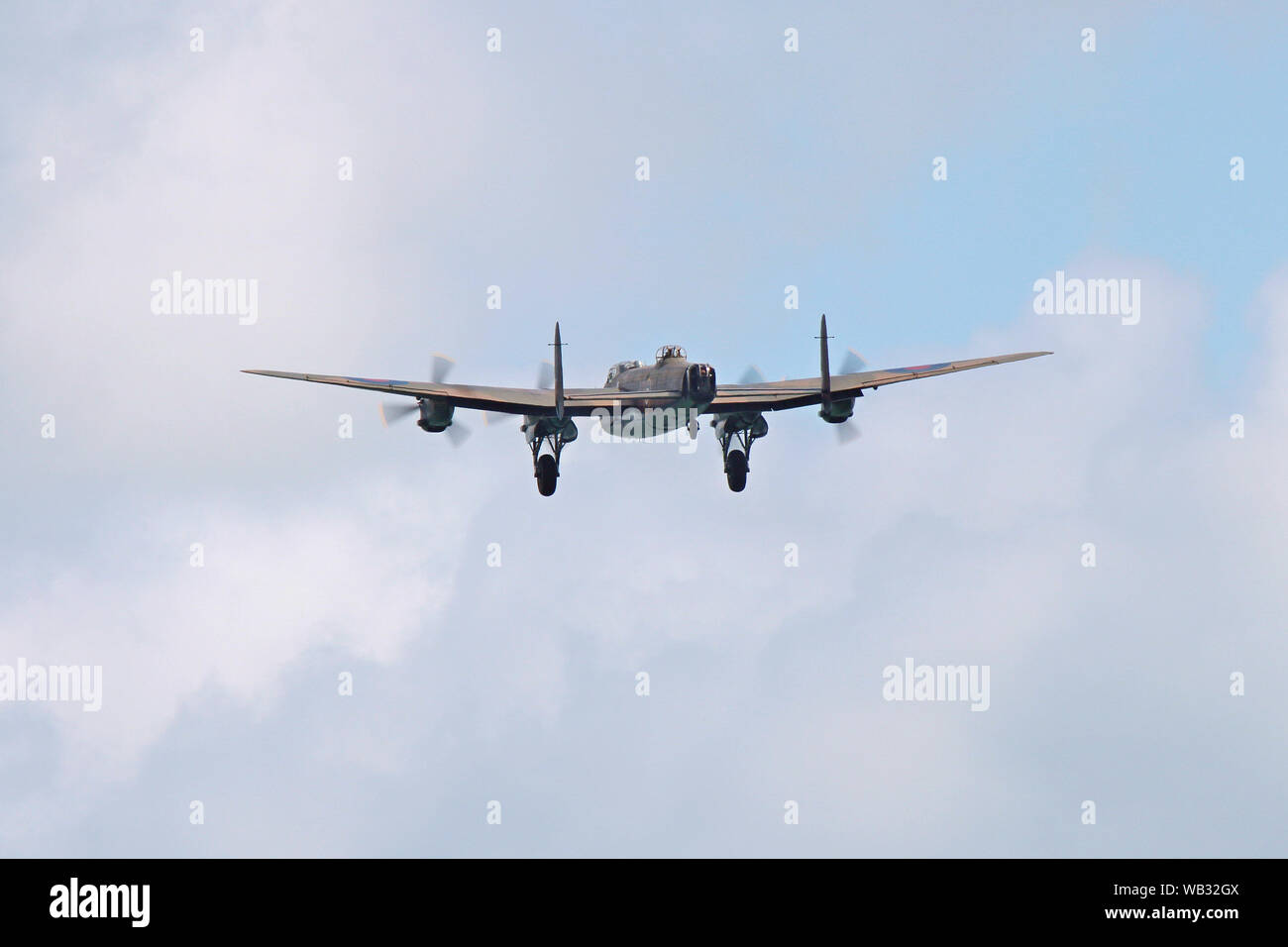 A tail view of the Avro Lancaster belonging to the Battle of Britain Memorial Flight. The aircraft has its undercarriage down. Stock Photo