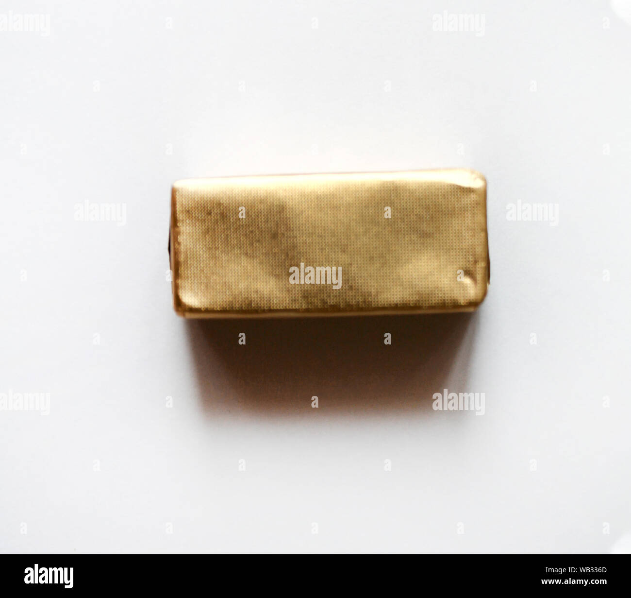 Rectangle chocolate candy wrapped in blue foil isolated on white ...