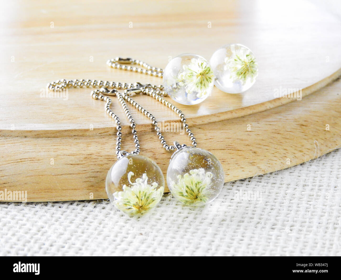 Dried Flower In Crystal Clear Resin Pendant Necklace Pendant With A Real Flowers Stock Photo Alamy