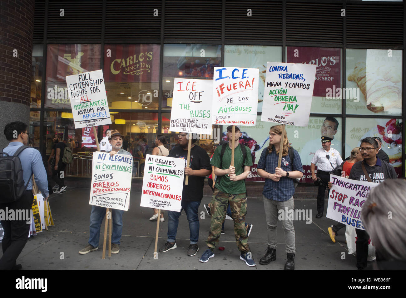 August 23, 2019: Demonstrators are shown protesting against Greyhound Corporation and ICE (Immigration Customs and Enforcement) at the Port Authority Bus Terminal on 42nd and 8th Avenue in New York, New York. About 100 activists from a coalition of groups including FIRE (Fight For Immigrant Refugees Everywhere) protested Greyhound allowing ICE agents to board their busses 'searching for migrants,'' officials said Credit: Brian Branch Price/ZUMA Wire/Alamy Live News Stock Photo