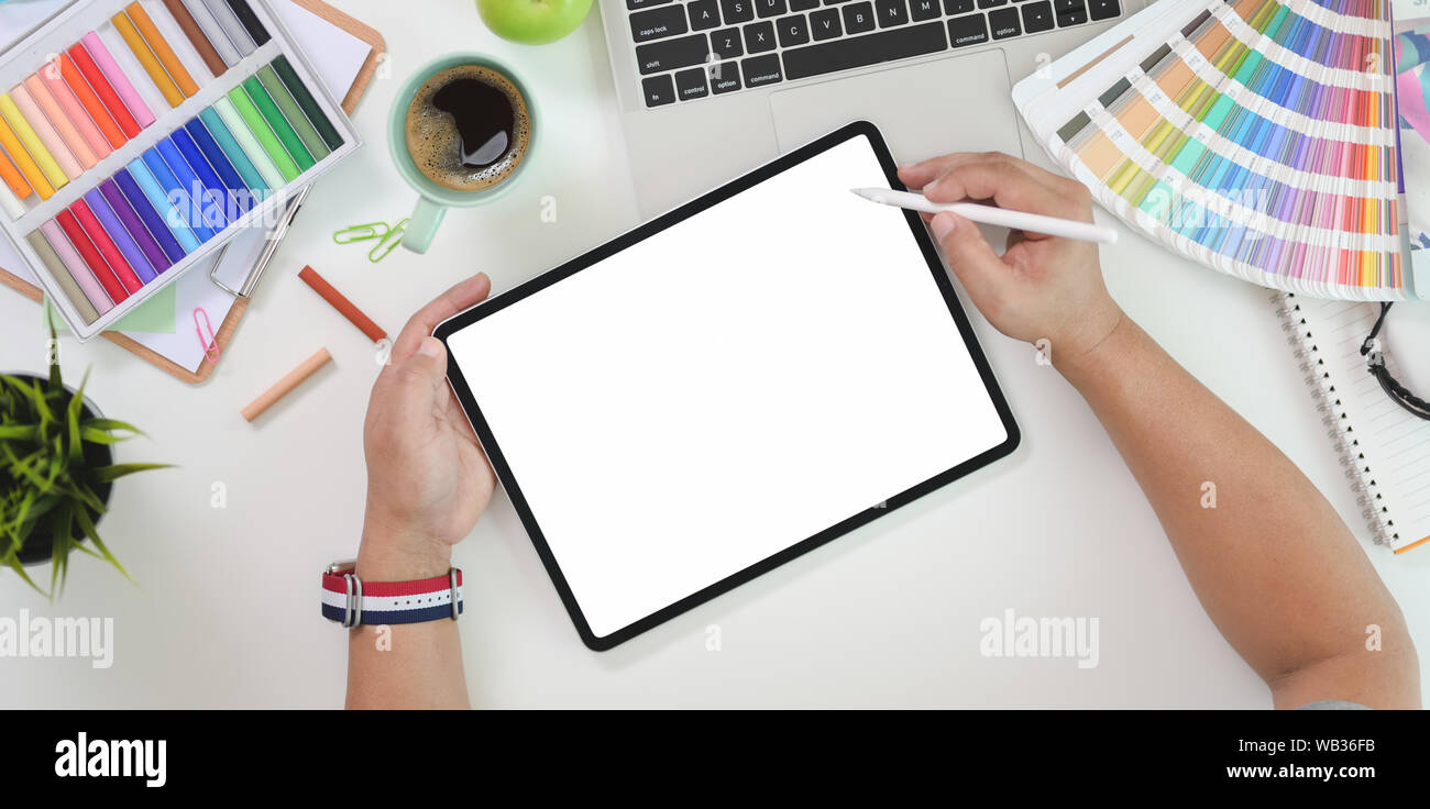 Top View Of Male Graphic Designer Drawing On Blank Screen Tablet