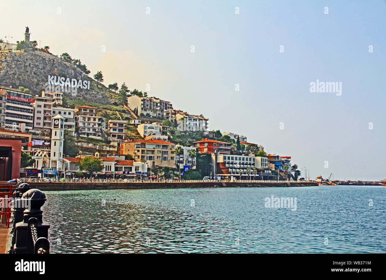 Kusadasi Sign on a Hillside Above Colorful City Buildings Stock Photo