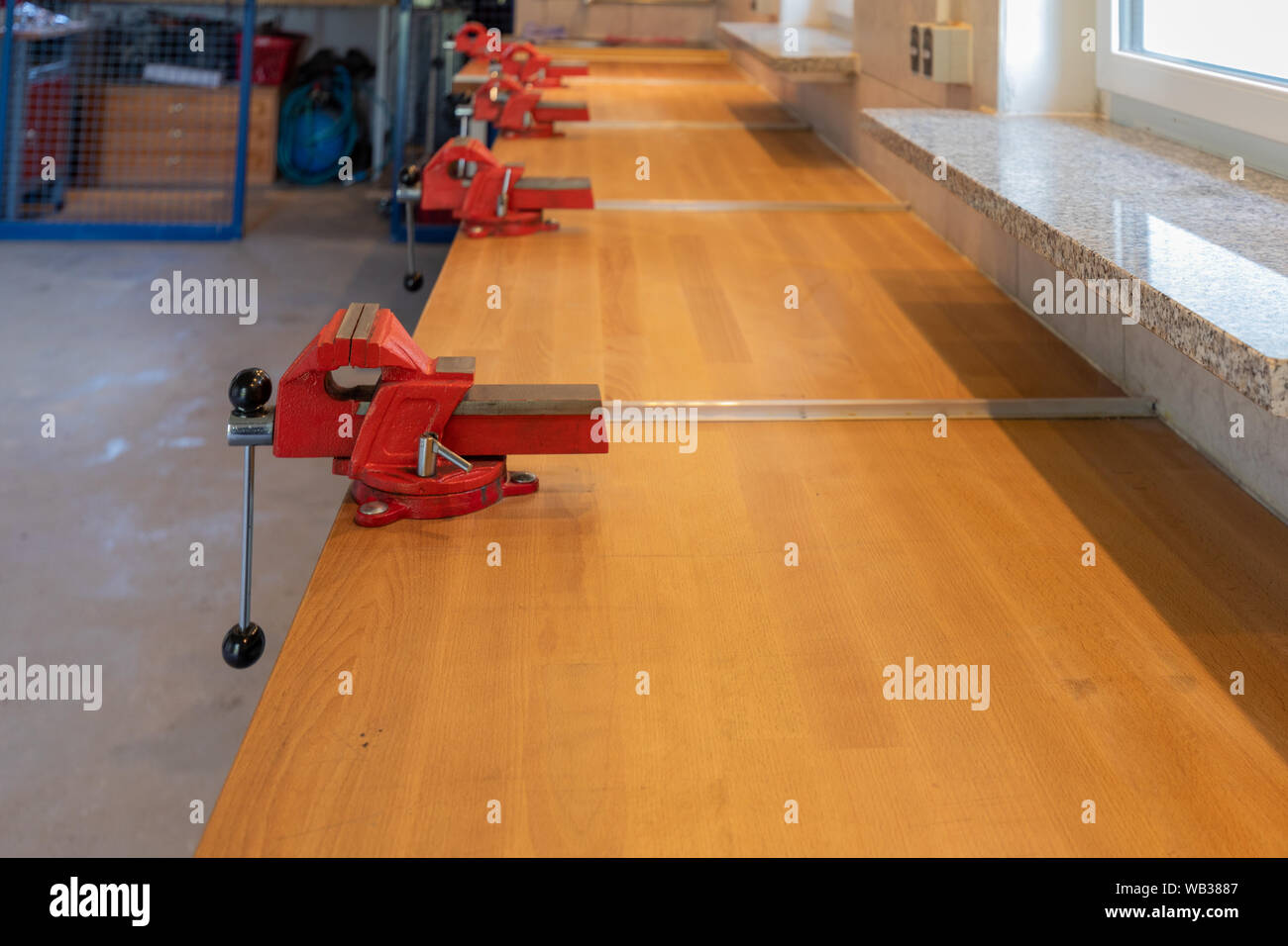 some red vices I find on a workbench in a children's workshop Stock ...