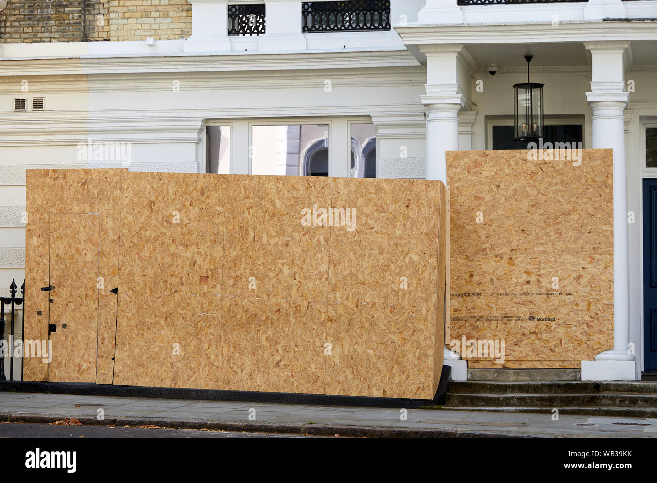 London, U.K. - August 23, 2019: Hoarding erected outside a house in Notting Hill prior to the annual carnival. Stock Photo