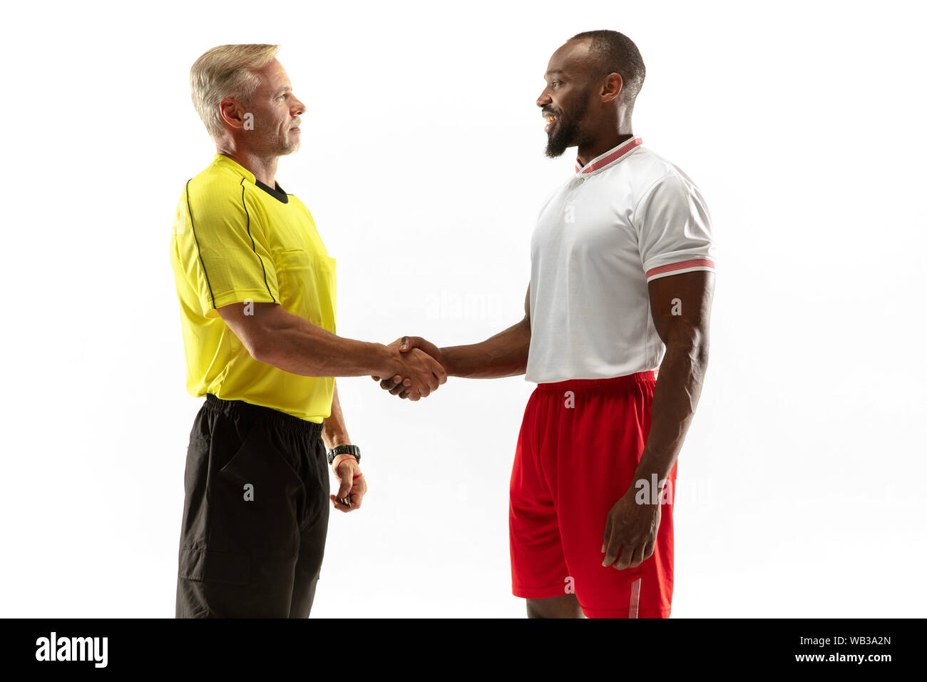 Referee gives directions with gestures to football or soccer players