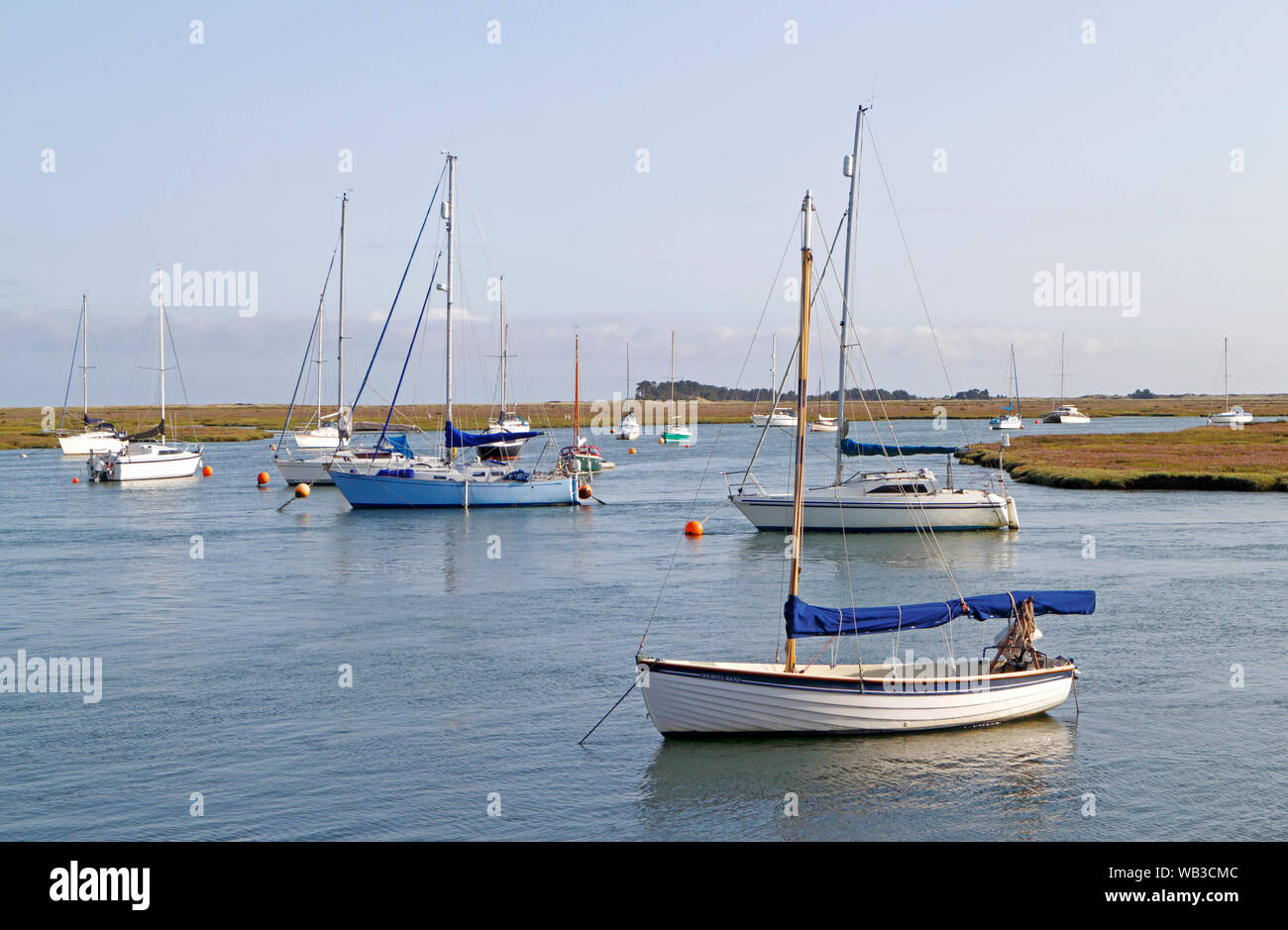 Dinghies, yachts, and sailboats, anchored in the east channel in the port of Wells-next-the-Sea, Norfolk, England, United Kingdom, Europe. Stock Photo