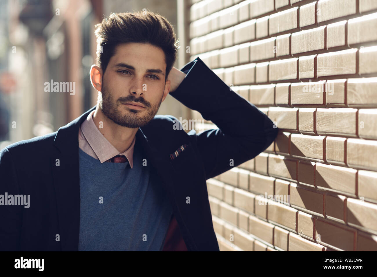 Attractive man wearing british elegant suit in the street. Modern ...