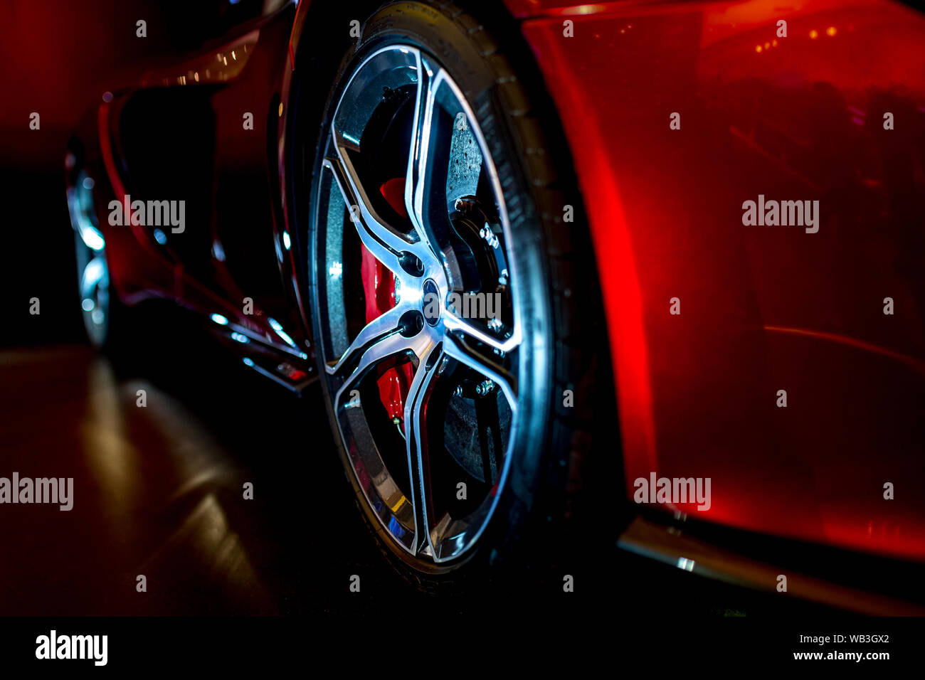 Close Up on beautiful modern supercar with dramatic lighting Stock Photo
