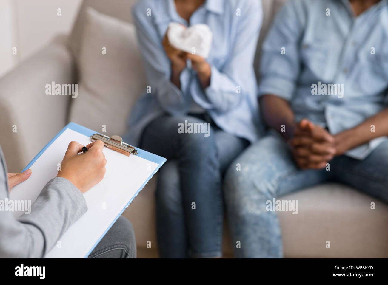 Couples therapist counselling frustrated african american spouses in office Stock Photo