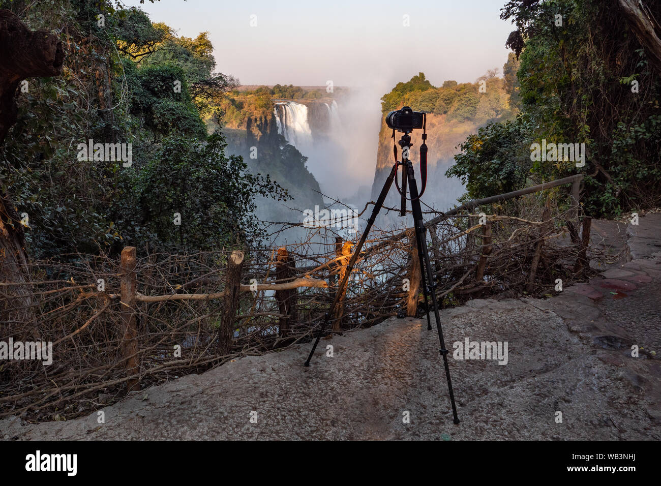 Victoria Falls and a Professional SLR Camera Set Up on a Tripod Stock Photo
