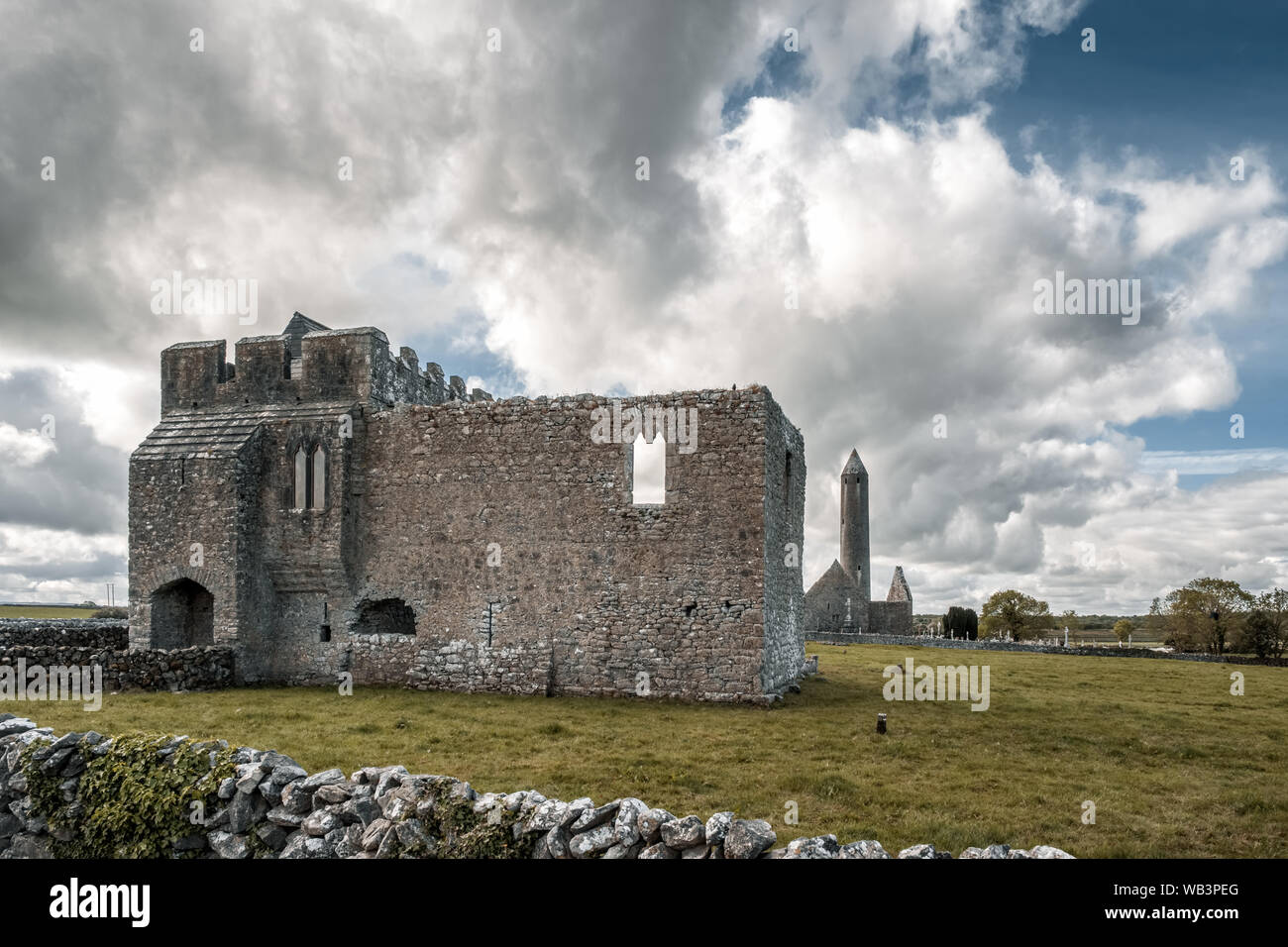 Kilmacduagh Monastery, Nr Gort, County Galway, Ireland - 20th May 2019. Glebe House, built in the 14th century, is part of Kilmacduagh Monastery near Stock Photo