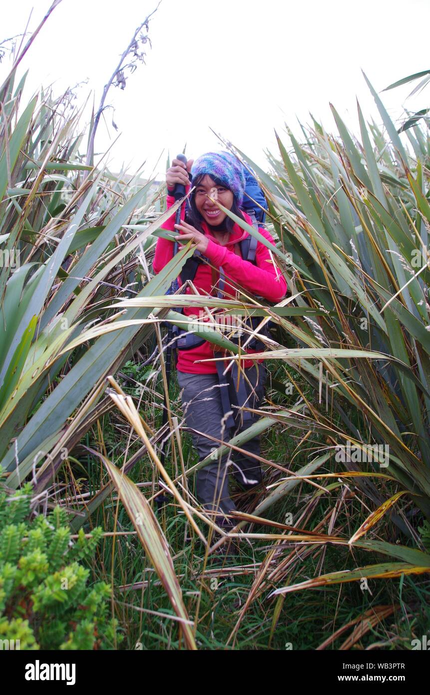 Thai female backpacker. Te Araroa Trail. Colac Bay. Southland. South