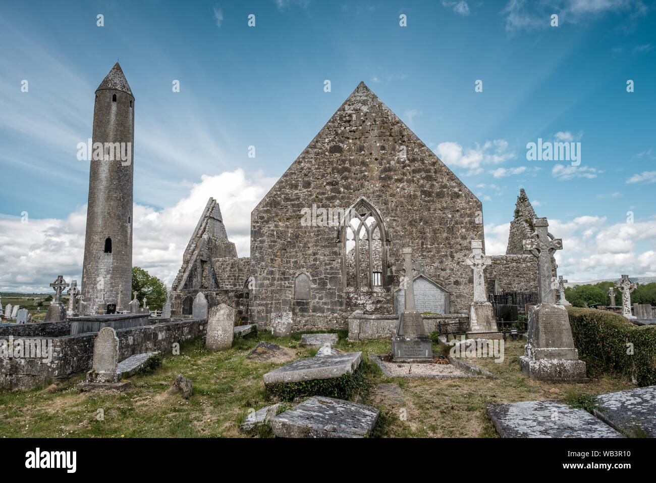 Kilmacduagh Monastery, Nr Gort, County Galway, Ireland - 20th May 2019. The Cathedral and Circular Tower built as a refuge for monks in the 12th centu Stock Photo