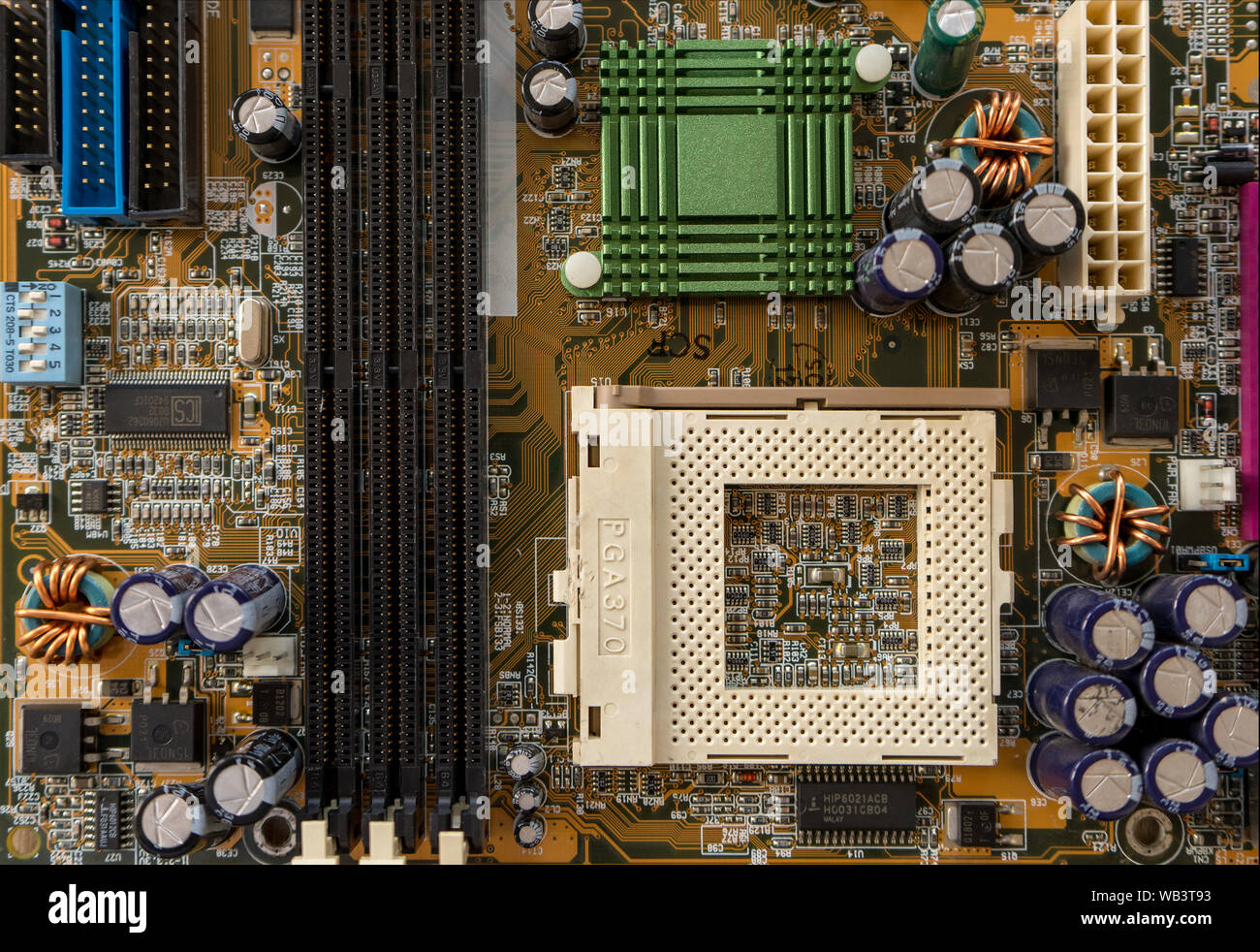 TIMISOARA, ROMANIA - DECEMBER 02, 2018: Close-up of an ASUS motherboard on a wooden table. CPU socket 370. Top view. Stock Photo