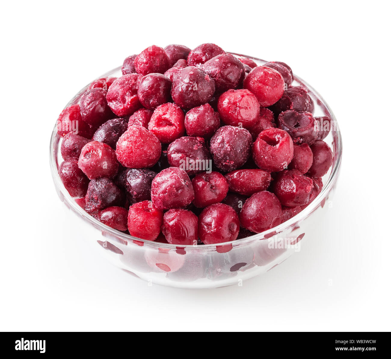 Frozen cherries in glass bowl isolated on white background with clipping path Stock Photo