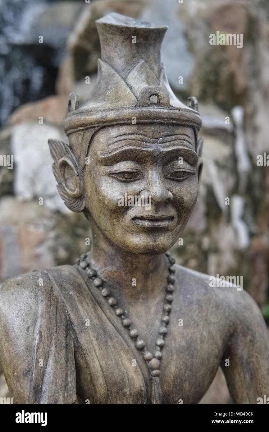 The figure of a russi or rishi,  an Indian-style hermit or yoga practitioner, in the grounds of Wat Po (Pho), Bangkok Thailand Stock Photo