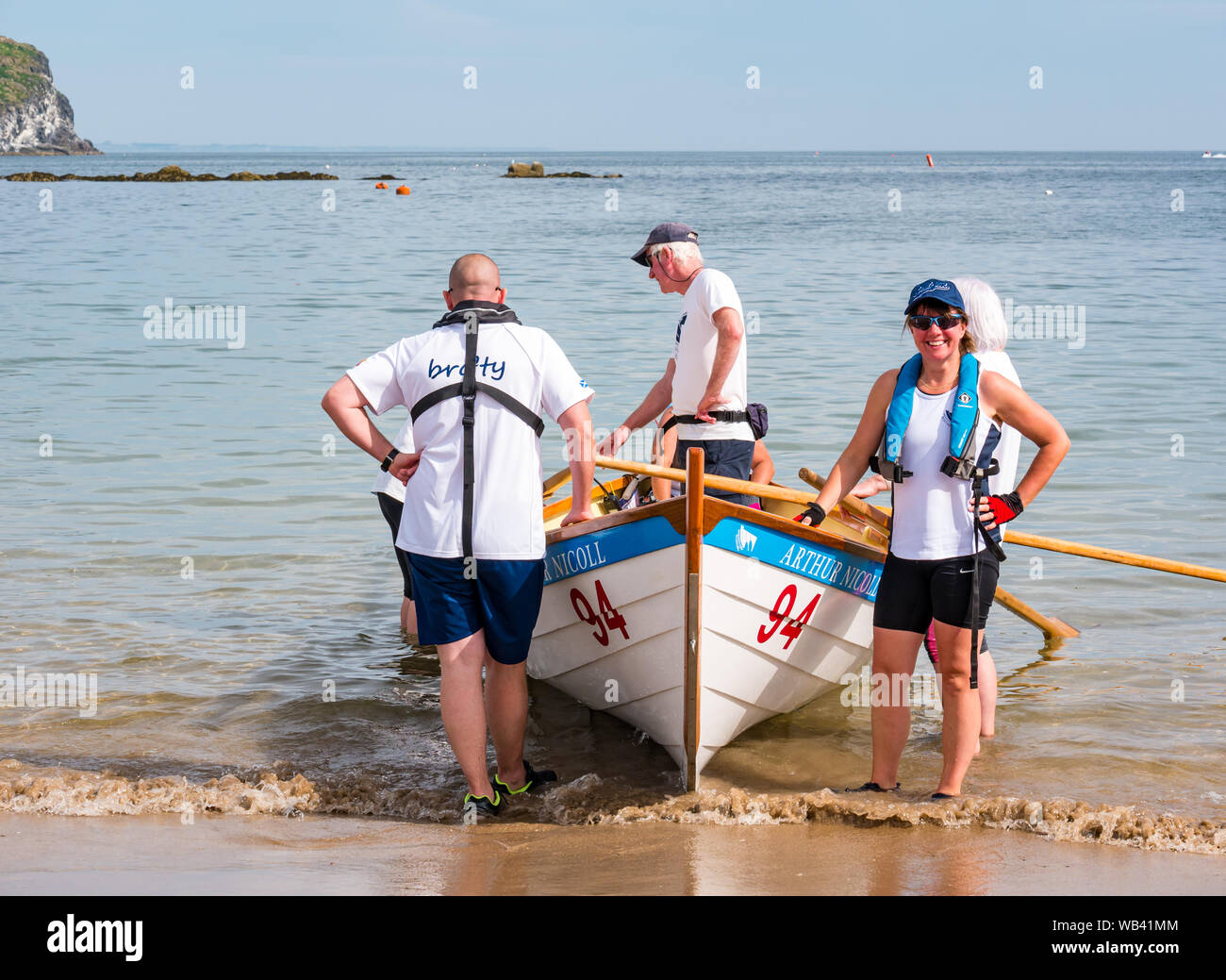 North Berwick, Scotland, UK, 24 August 2019. Colourful rowing skiffs ...