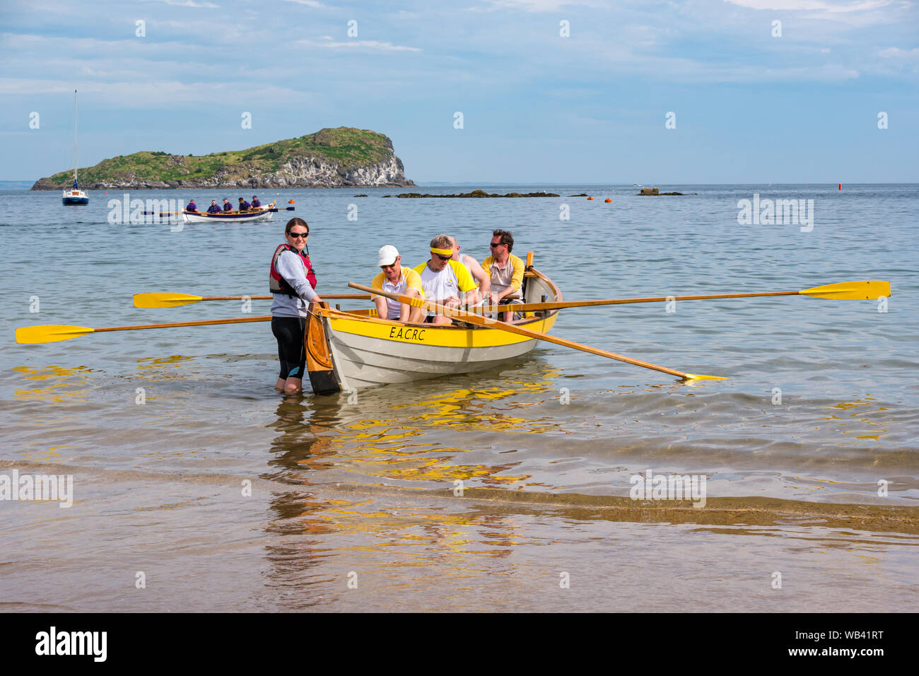 North Berwick, Scotland, UK, 24 August 2019. Colourful rowing skiffs ...