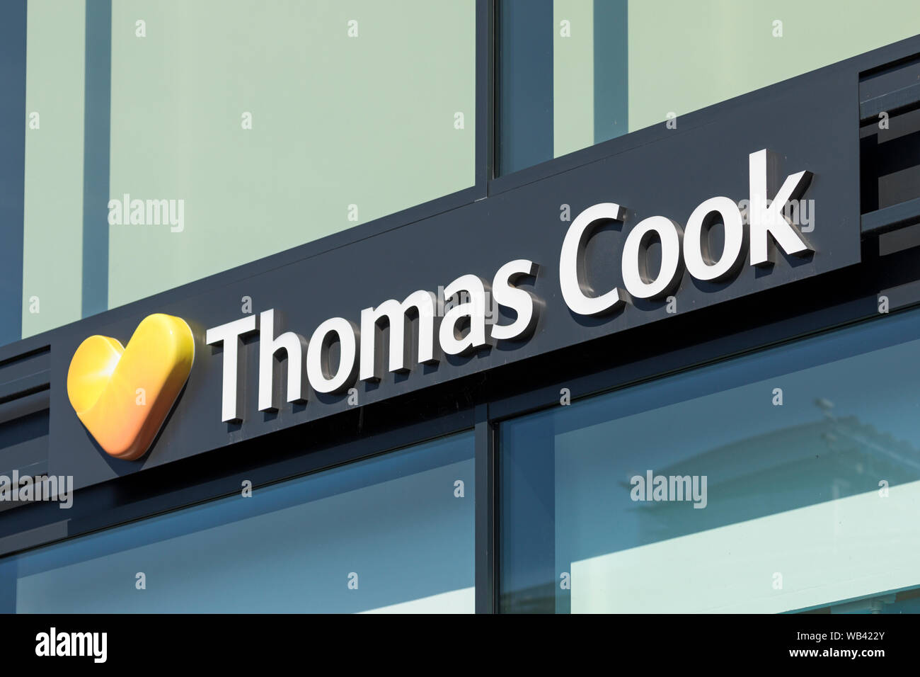 Stade, Germany - August 22, 2019: Signage identifying a Thomas Cook travel agencies branch Stock Photo