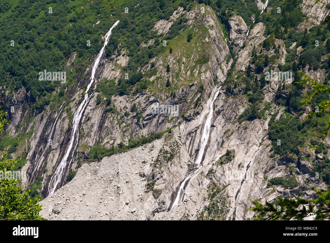 Waterfalls on the slope of the Aiguilles du Dru, a mountain of the Mont Blanc massif in the French Alps, in summer, Montenvers, Chamonix, France Stock Photo