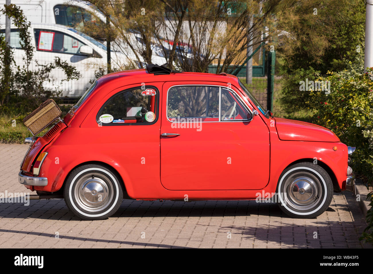 Stade, Germany - August 22, 2019: A  red vintage FIAT 500 or Cinquecento in a parking lot. Stock Photo