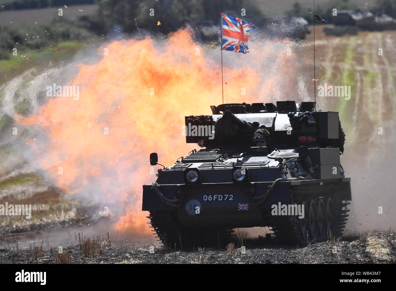 Enthusiasts at the Tanks, Trucks and Firepower show, in the village of Dunchurch in Warwickshire. Stock Photo