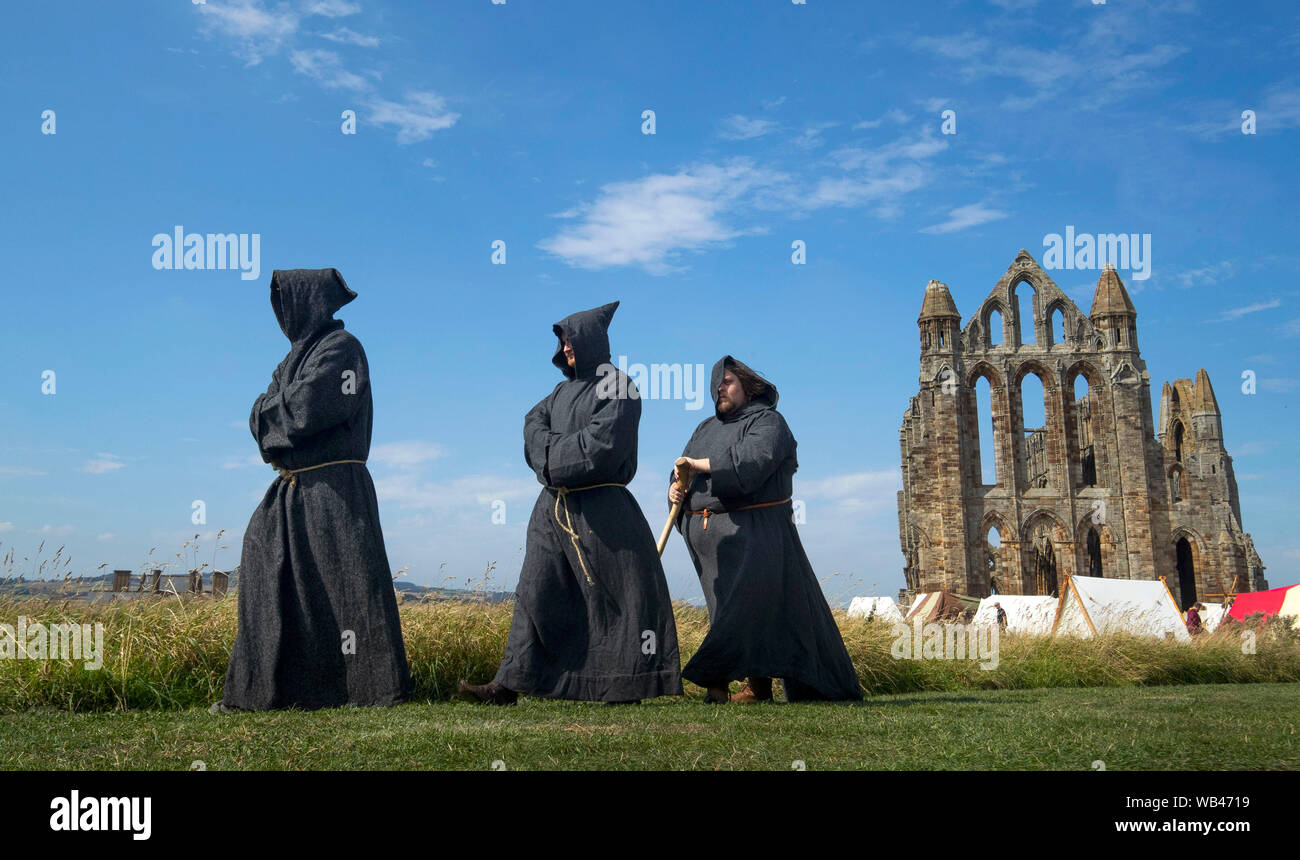 Viking monk reenactors at Whitby Abbey as hordes of Vikings descend on