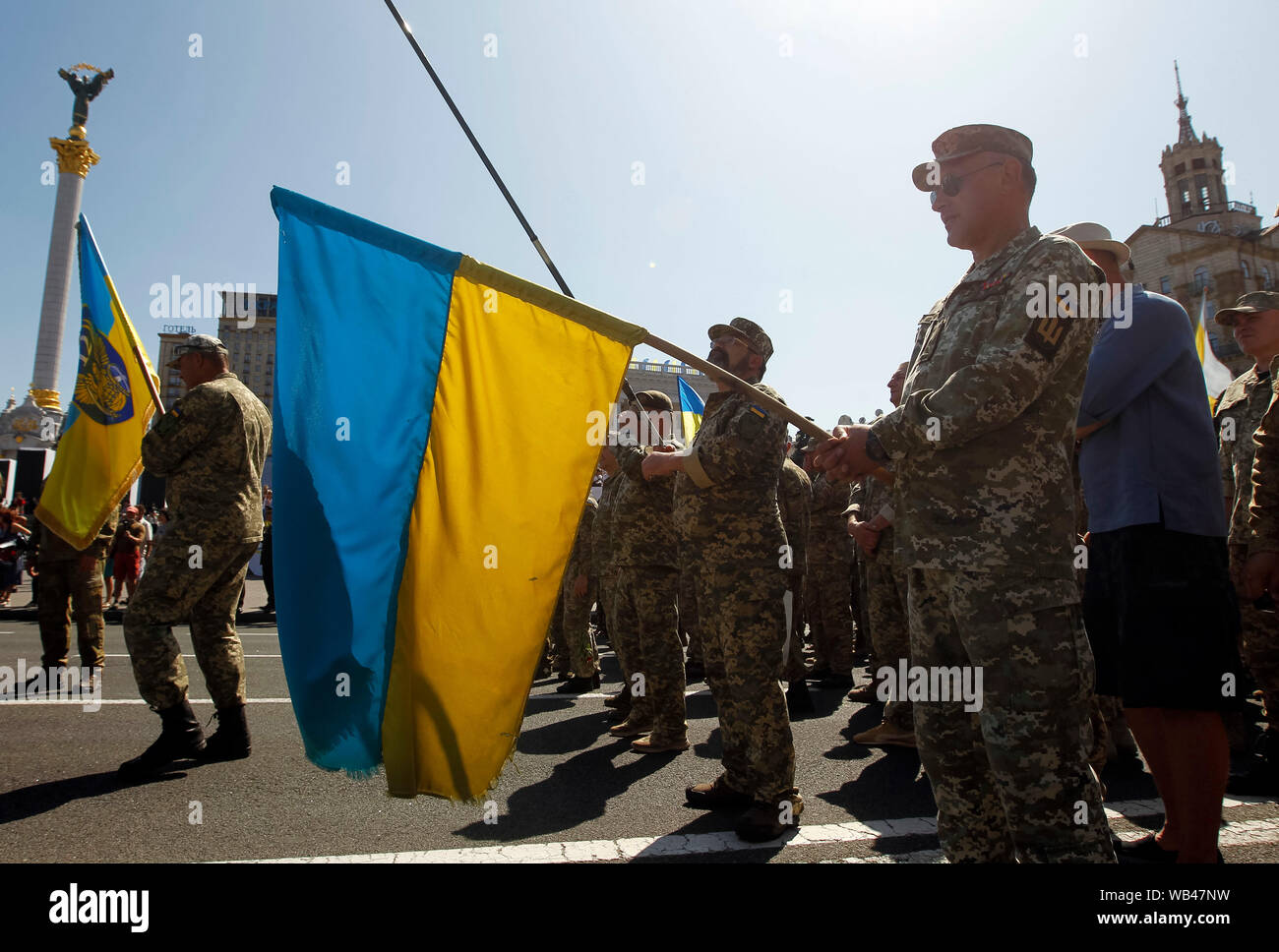 A Ukrainian serviceman holds a Ukrainian flag while marching at the Independence Square during the Anniversary.Ukraine marks the 28th Independence Day Anniversary from the Soviet Union since 1991 on August 24, 2019. Stock Photo