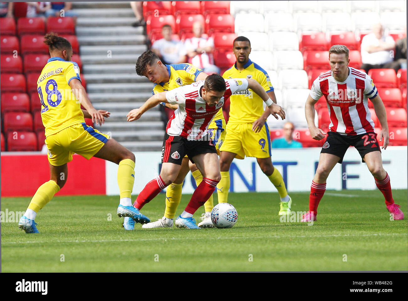 Sunderland, UK. 24th Aug, 2019.Sunderland, UK. 24th Aug, 2019. Sunderland's Lynden Gooch competes for the ball with AFC Wimbledon's Nesta Guinnes-Walker during the Sky Bet League 1 match between Sunderland and AFC Wimbledon at the Stadium Of Light, Sunderland on Saturday 24th August 2019. (Credit: Steven Hadlow | MI News) Editorial use only, license required for commercial use. No use in betting, games or a single club/league/player publications. Photograph may only be used for newspaper and/or magazine editorial purposes Credit: MI News & Sport /Alamy Live News Stock Photo