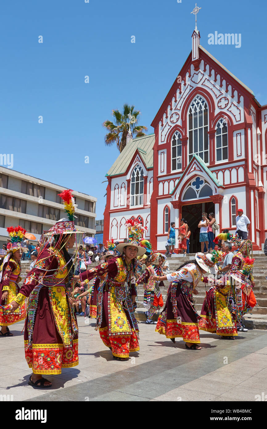 Men and women of the group Thinkus Rupay Masis, performing at the annual street carnival celebrating the strength of the sun. Stock Photo