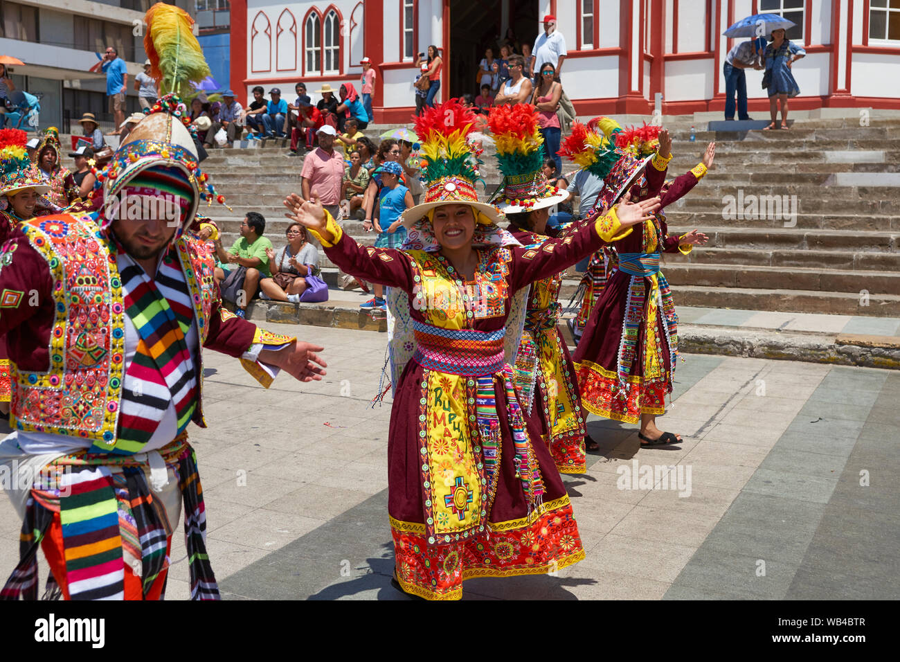 Men and women of the group Thinkus Rupay Masis, performing at the annual street carnival celebrating the strength of the sun. Stock Photo