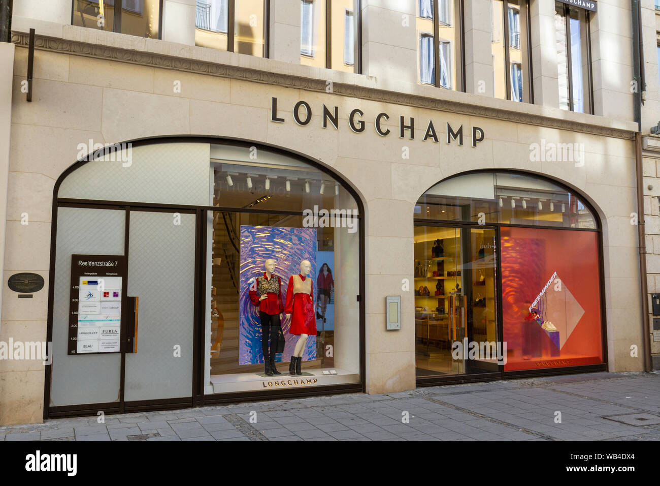 Opening of the Louis Vuitton store in the Residenzstrasse. Customers admire  bags Stock Photo - Alamy