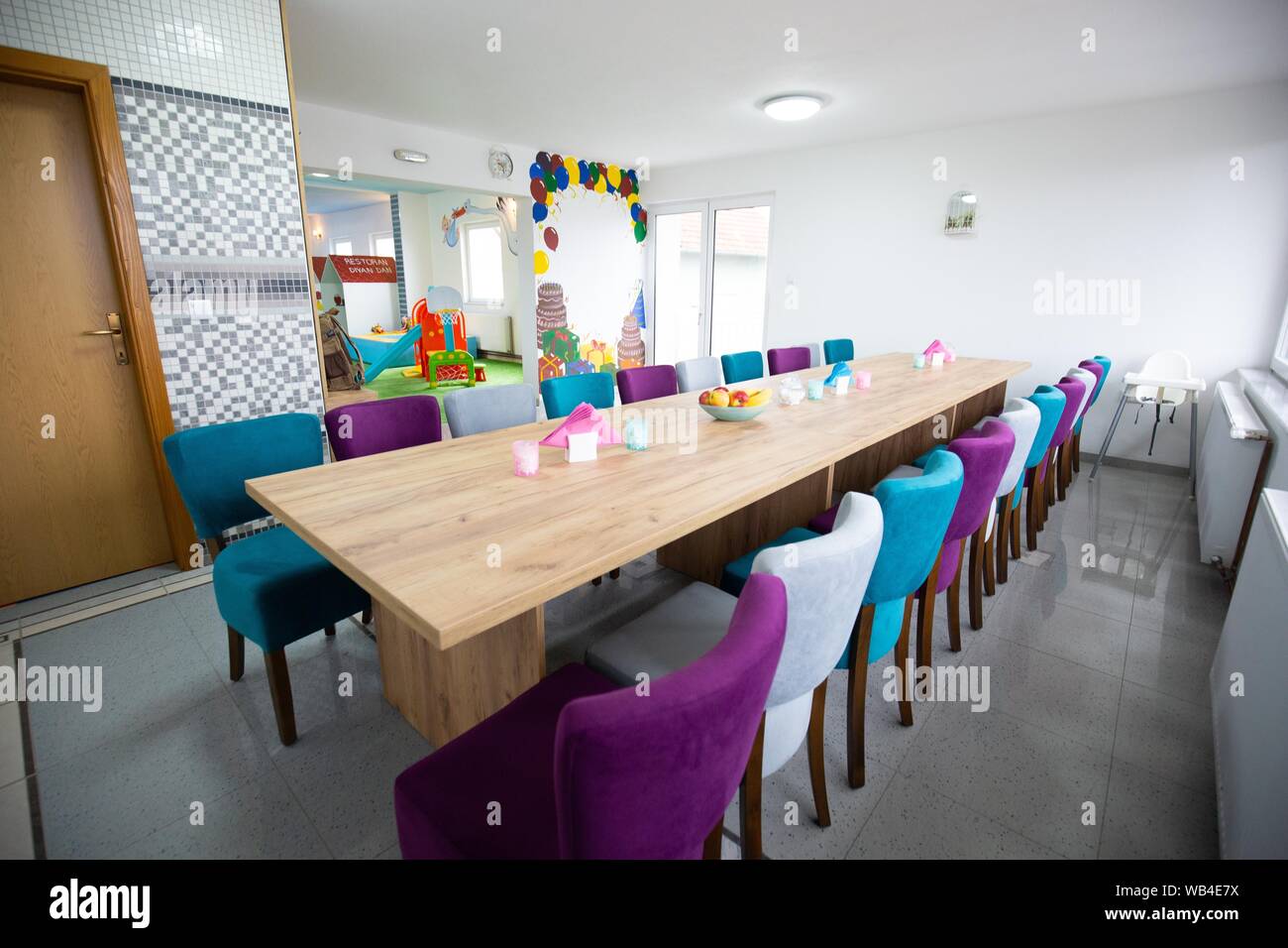 A Wide Shot Of An Empty Dining Area At A Daycare Center