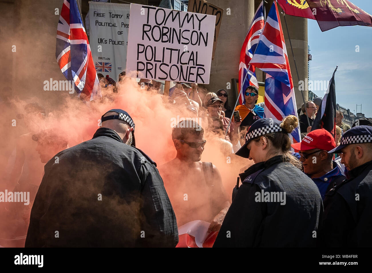 London, UK. 24th August, 2019. 'Free Tommy Robinson' protest outside BBC Broadcasting House. Police make over twenty arrests during a demonstration in support of the jailed Tommy Robinson, real name Stephen Yaxley-Lennon, who was sentenced last month to nine months in prison after being found guilty in contempt of court. Counter-protesters including antifascist activists and the anti-racist group: Stand Up to Racism, opposed the pro-Robinson demonstrators with protest groups kept apart by met police with some clashes. Credit: Guy Corbishley/Alamy Live News Stock Photo