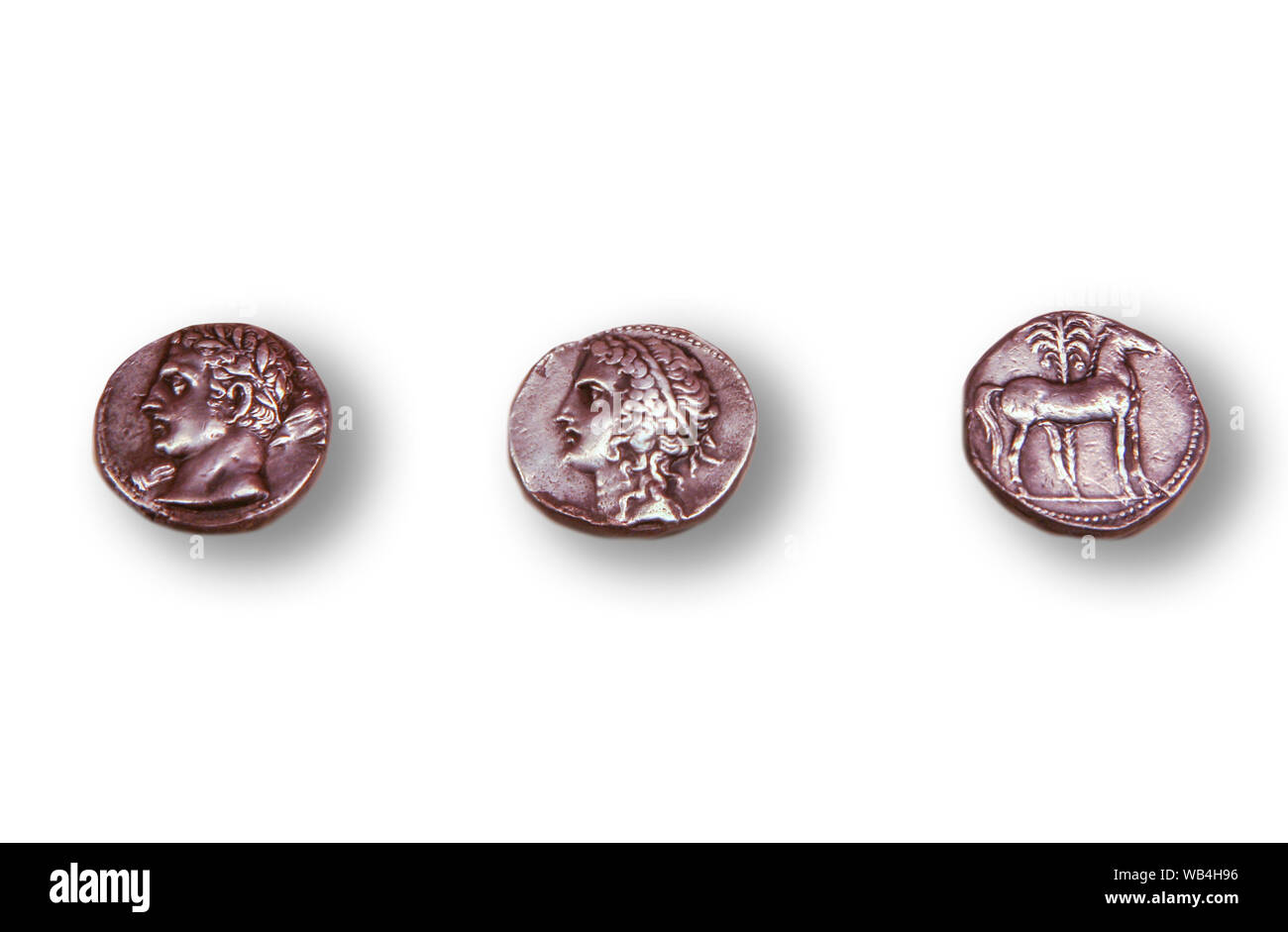 Madrid, Spain- April 20th, 2008: 3 Carthaginian coins. Isolated over white. National Archeological Museum in Madrid, Spain Stock Photo