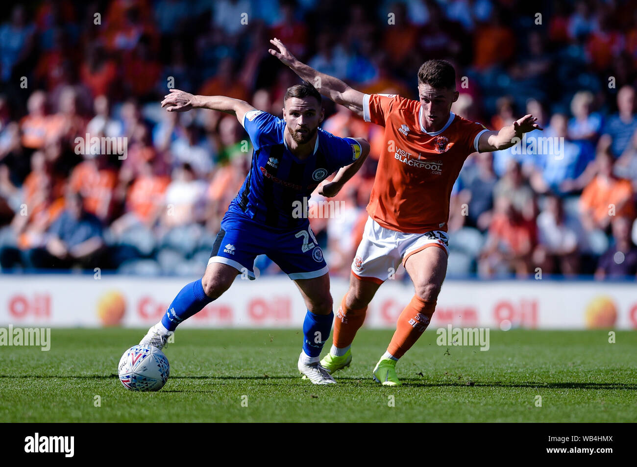 Rochdale, UK. 24th Aug, 2019. Rochdale midfielder Jimmy Ryan and Blackpool  midfielder Jordan Thompson during the Sky Bet League 1 match between  Rochdale and Blackpool at Spotland Stadium, Rochdale on Saturday 24th