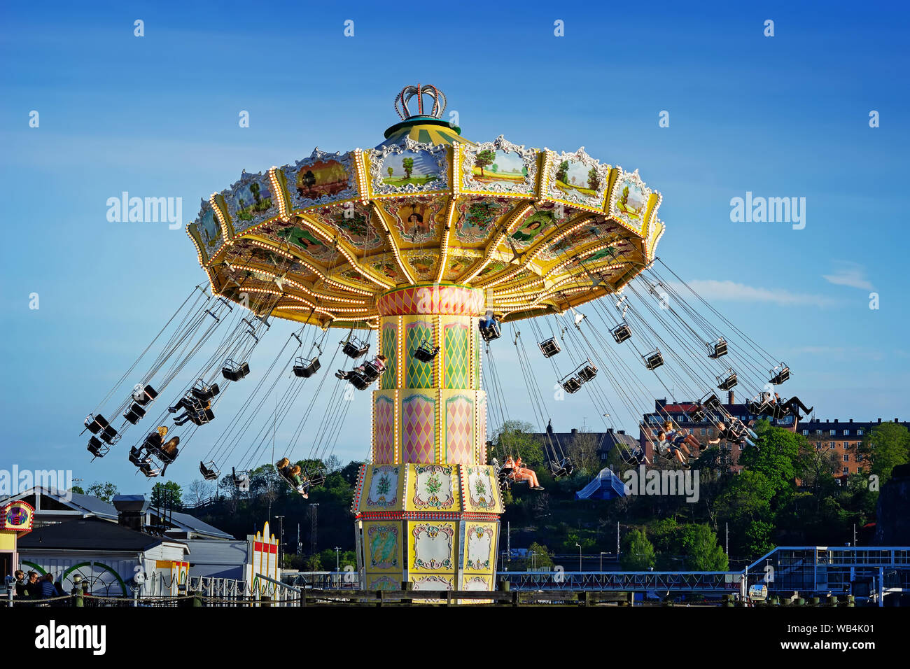 People spinning in Eclipse (Ferris wheel) attraction at the Tivoli Grona Lund amusement park, Djurgarden, Stockholm Sweden Stock Photo