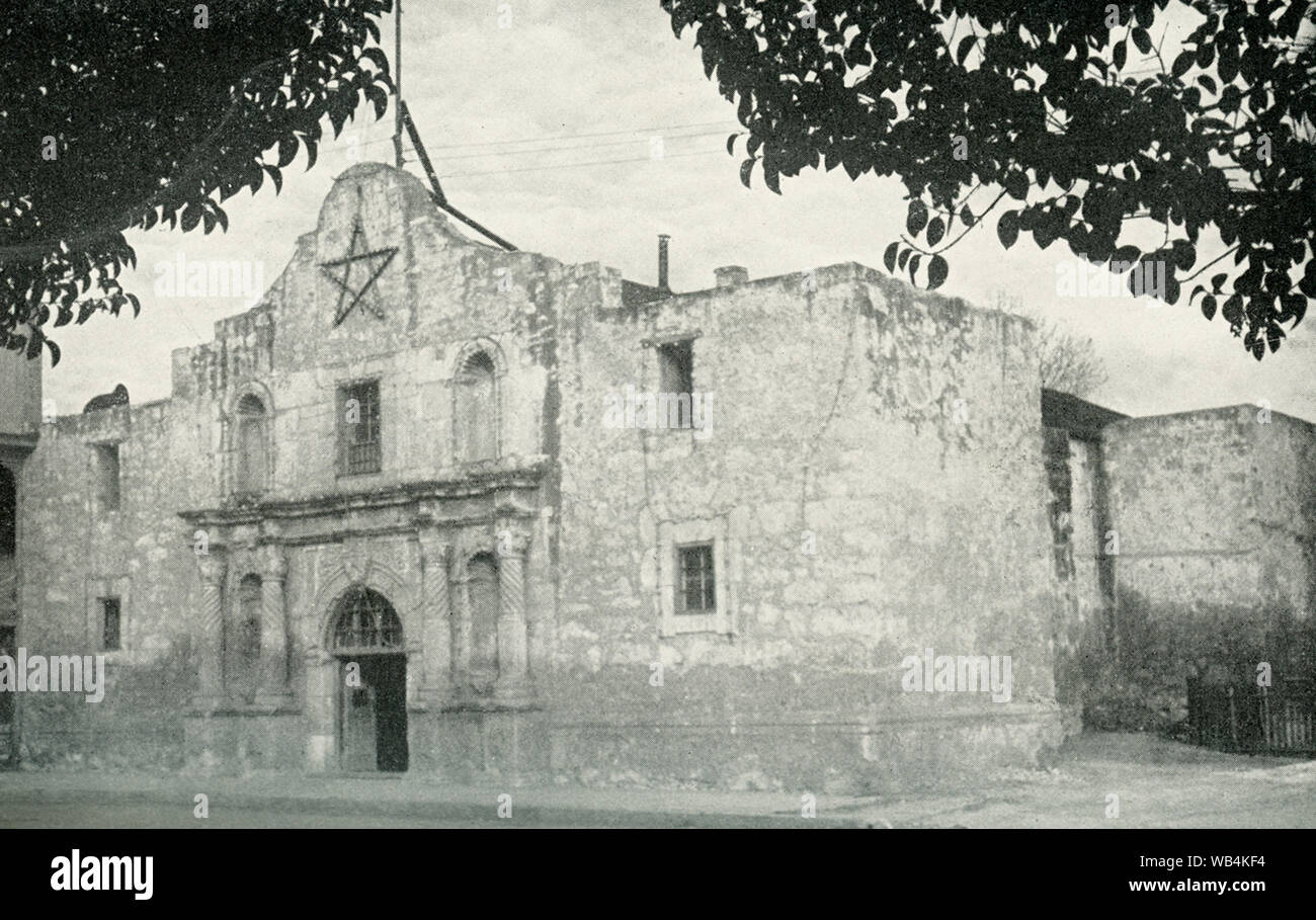 This p[hotos dates to the 1920s. Its caption reads: The Texas Cradle of Liberty.  The Alamo, at San Antonio, sacred to the memory of David Crockett and the gallant defenders wgo in 1836 ‘gave their lives that their country might liive.’ The battle cry that led to ultimate victory over the Mexicans was: ‘Remember the Alamo.” Stock Photo