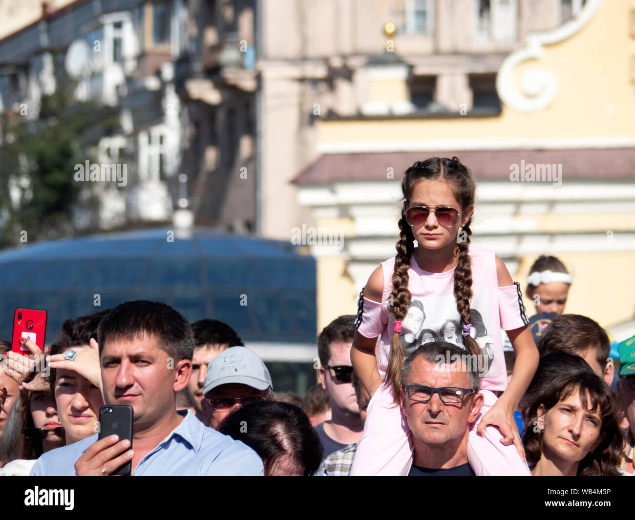 Ukrainians watching the Procession of Dignity.President Vladimir Zelensky, leader of the state, military APU, volunteers, athletes, prominent Ukrainians and others took part in the Procession of Dignity dedicated to the 28th anniversary of Independence Day of Ukraine held in Kiev. Stock Photo