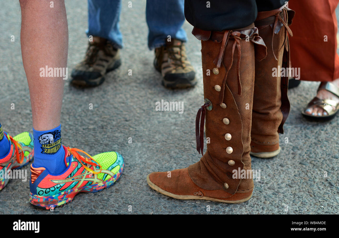 A man wearing Native American moccasin boots talks with friends at the  Santa Fe Indian Market in New Mexico, USA Stock Photo - Alamy
